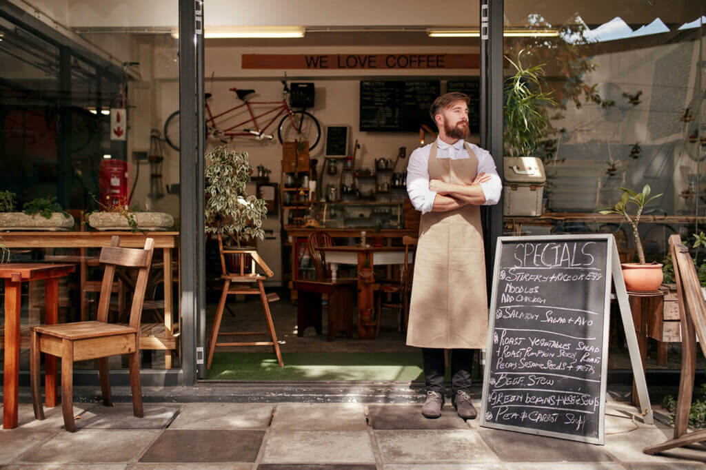 Business Owner In Front of Shop with Chalkboard